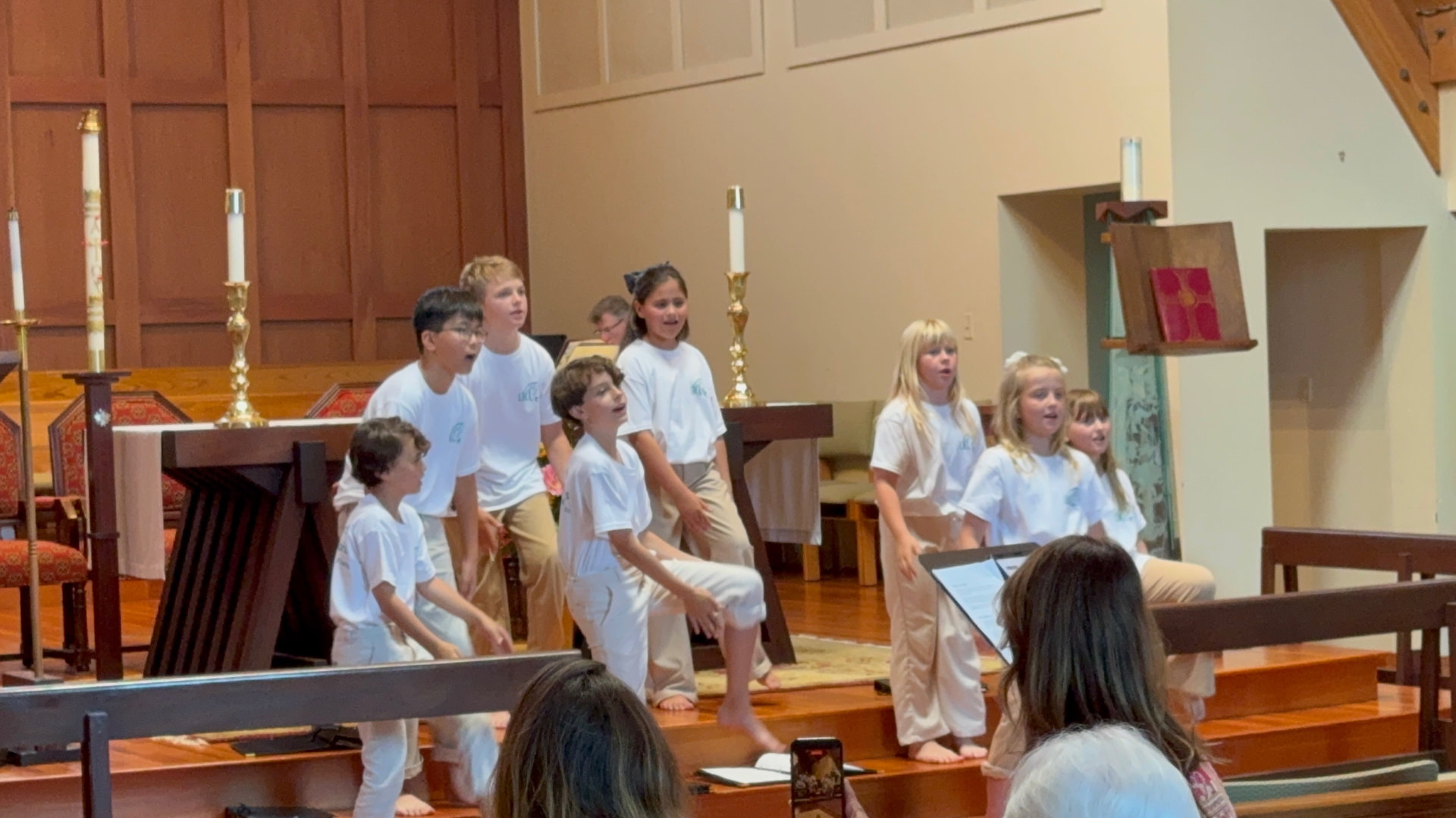 Singers stepping forward together during a performance